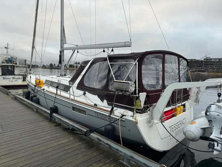 Hey Jude III Yacht Photos Pics 2015 Beneteau Oceanis 45 sailboat docked at marina, overcast sky.