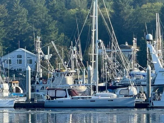 Hey Jude III Yacht Photos Pics Beneteau Oceanis 45 sailboat docked in a marina, surrounded by other boats, 2015 model.