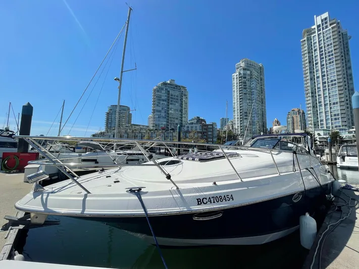 Samari Yacht Photos Pics 2007 Regal 3760 Sportyacht docked in urban marina with skyscrapers in background.