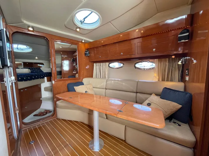 Samari Yacht Photos Pics Luxurious interior of a 2007 Regal 3760 Sportyacht with elegant seating and wooden finishes.