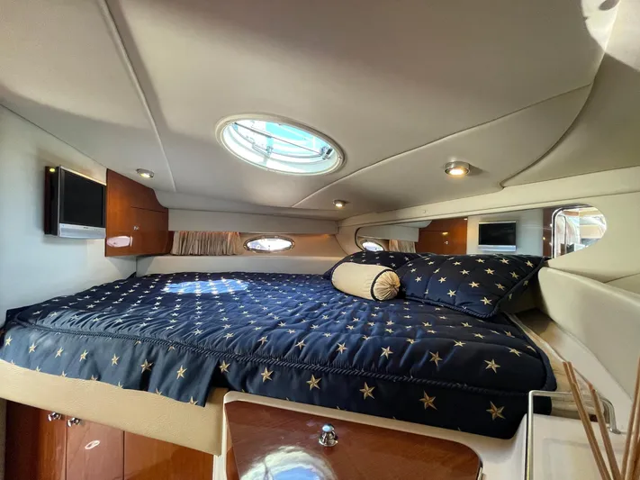 Samari Yacht Photos Pics Luxurious cabin interior of 2007 Regal 3760 Sportyacht with star-patterned bedding.