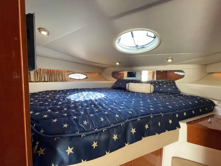 Samari Yacht Photos Pics Luxurious cabin interior of 2007 Regal 3760 Sportyacht with star-patterned bedding.