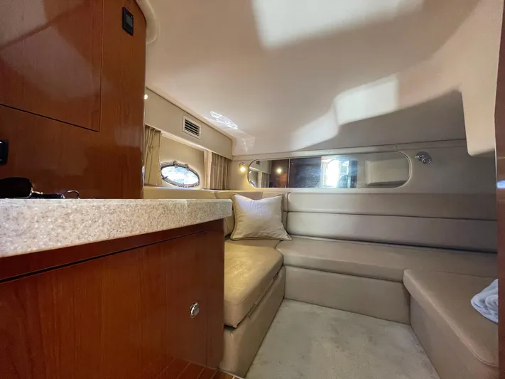 Samari Yacht Photos Pics 2007 Regal 3760 Sportyacht interior with cozy seating and elegant wood finishes.
