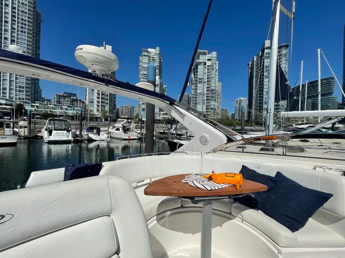 Samari Yacht Photos Pics 2007 Regal 3760 Sportyacht docked in urban marina with city skyline.