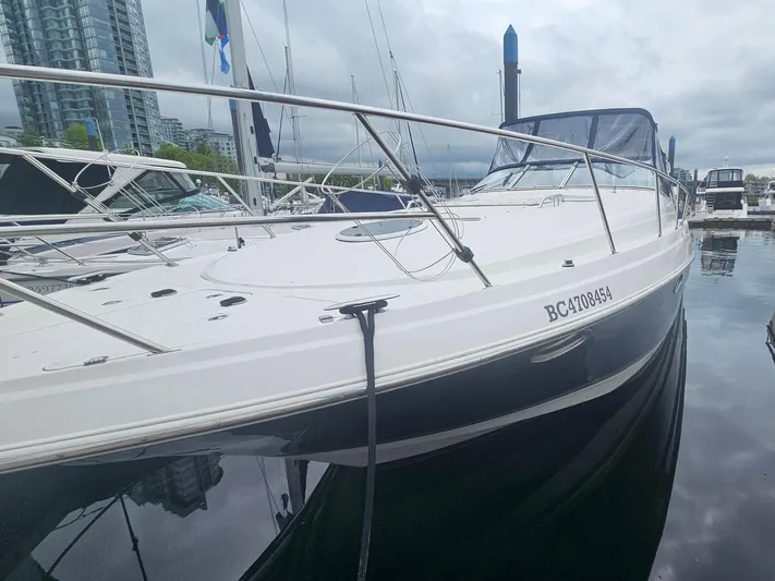 Samari Yacht Photos Pics 2007 Regal 3760 Sportyacht docked at marina, overcast sky, sleek design.