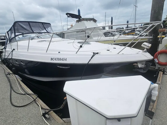 Samari Yacht Photos Pics 2007 Regal 3760 Sportyacht docked at marina under cloudy skies.