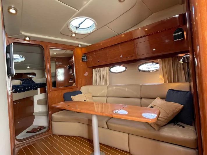 Samari Yacht Photos Pics Luxurious interior of 2007 Regal 3760 Sportyacht with plush seating and elegant wood finishes.