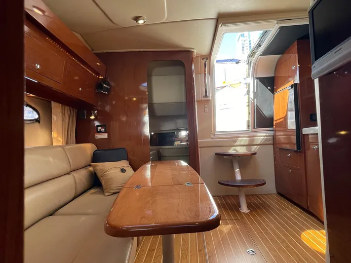 Samari Yacht Photos Pics Interior of 2007 Regal 3760 Sportyacht with wood finishes and beige seating.