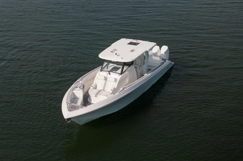  Yacht Photos Pics 2026 Fountain 43 SCX boat on calm water, showcasing sleek design and modern features.