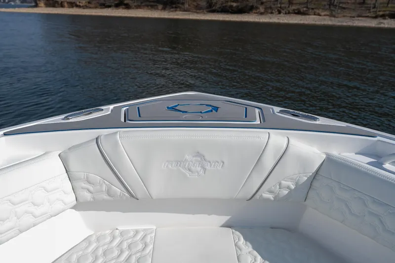  Yacht Photos Pics 2026 Fountain 43 SCX boat interior with white seating, on calm water.