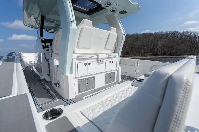  Yacht Photos Pics 2026 Fountain 43 SCX boat interior with luxurious seating and modern design on a sunny day.