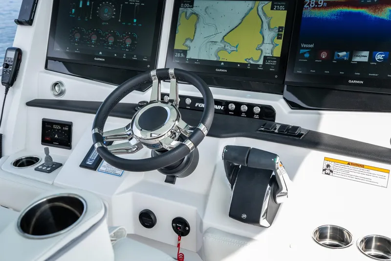  Yacht Photos Pics 2026 Fountain 43 SCX boat dashboard with advanced Garmin navigation displays and controls.