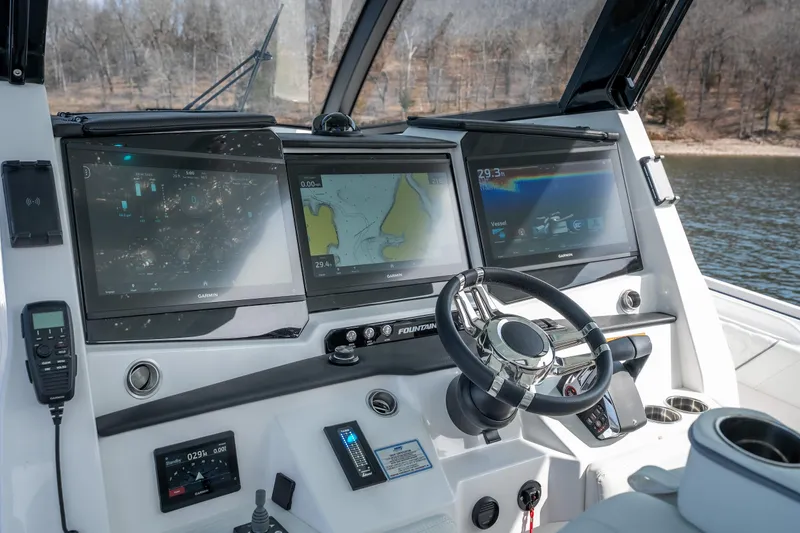  Yacht Photos Pics 2026 Fountain 43 SCX boat dashboard with advanced navigation displays and steering wheel.