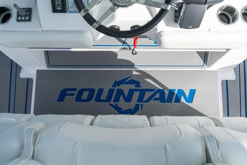  Yacht Photos Pics Interior view of 2026 Fountain 43 SCX boat cockpit with logo on floor mat.