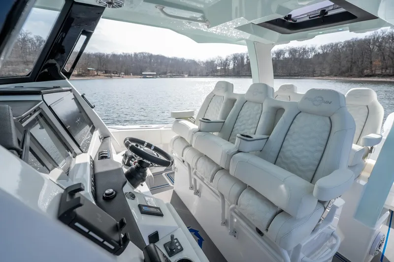  Yacht Photos Pics Interior of 2026 Fountain 43 SCX boat with luxurious seating and advanced controls.