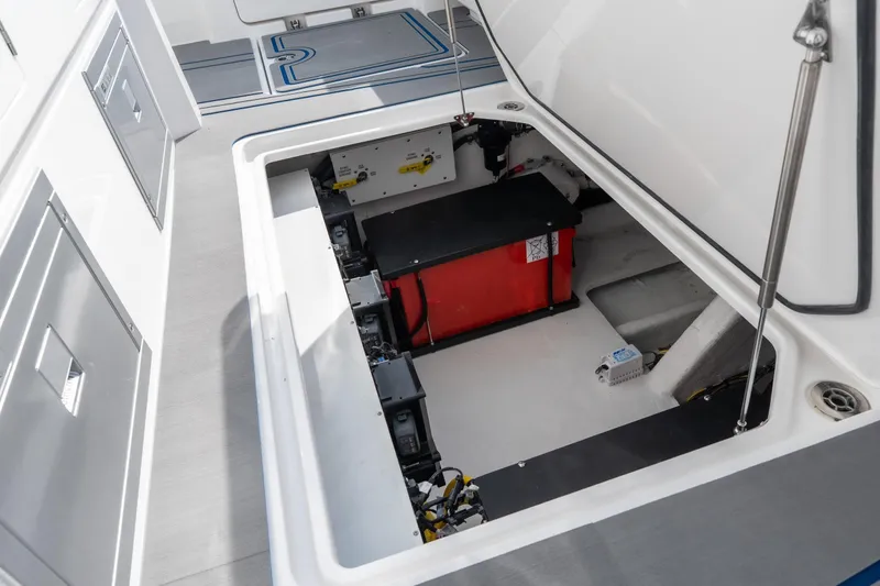  Yacht Photos Pics Open storage compartment in 2026 Fountain 43 SCX boat, showcasing interior equipment.