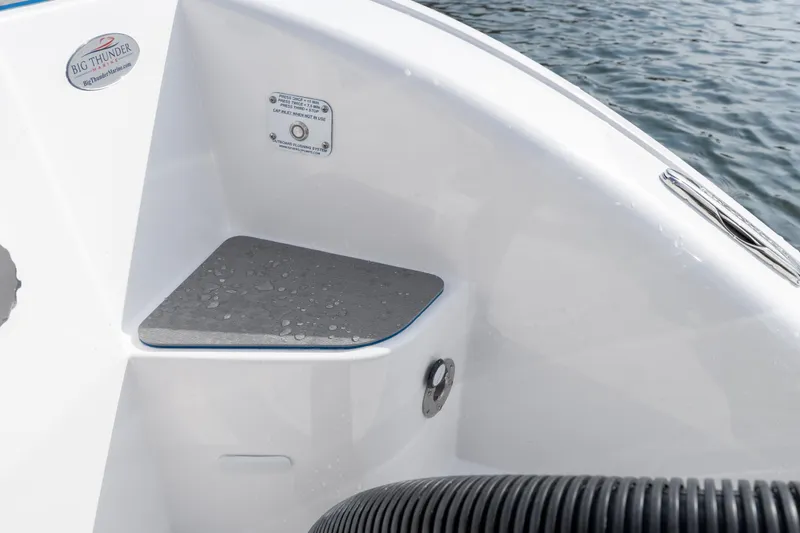  Yacht Photos Pics 2026 Fountain 43 SCX boat detail with water droplets on the deck near the water.