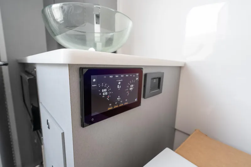  Yacht Photos Pics 2026 Fountain 43 SCX boat interior with modern control panel and glass sink.