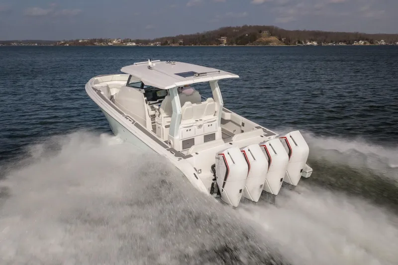  Yacht Photos Pics 2026 Fountain 43 SCX boat cruising on open water with powerful engines.