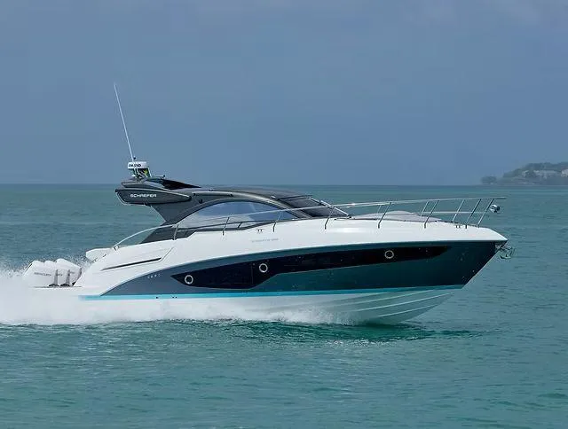  Yacht Photos Pics 2026 Schaefer 400 yacht cruising on open water, sleek design, modern features.