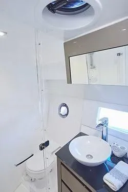  Yacht Photos Pics Modern bathroom in 2026 Schaefer 400 yacht with sleek fixtures and round sink.