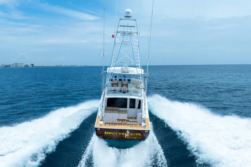 Knotty Girl Yacht Photos Pics 2005 Viking 52 Convertible yacht Knotty Girl cruising on open water.