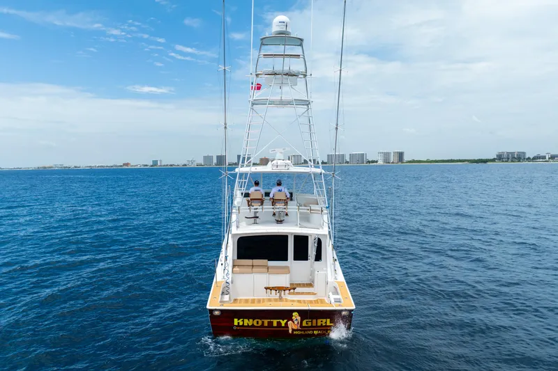 Knotty Girl Yacht Photos Pics 2005 Viking 52 Convertible yacht Knotty Girl cruising on open water.