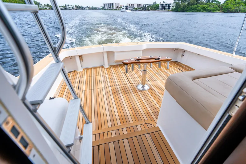 Knotty Girl Yacht Photos Pics View from the deck of a 2005 Viking 52 Convertible yacht cruising on a river.