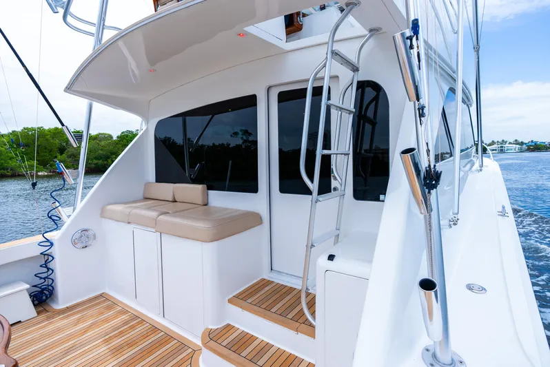 Knotty Girl Yacht Photos Pics 2005 Viking 52 Convertible yacht with teak deck and cushioned seating.