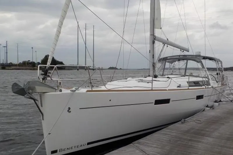  Yacht Photos Pics 2017 Beneteau Oceanis 45 sailboat docked on a cloudy day.