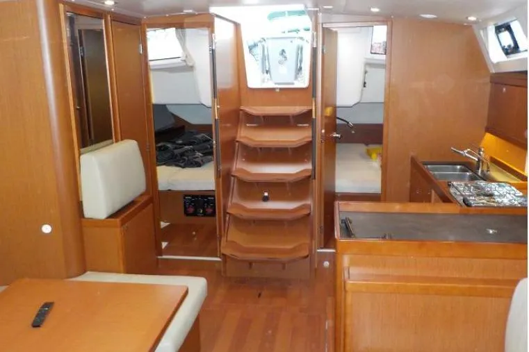  Yacht Photos Pics Interior of 2017 Beneteau Oceanis 45 yacht with wood finish and modern amenities.