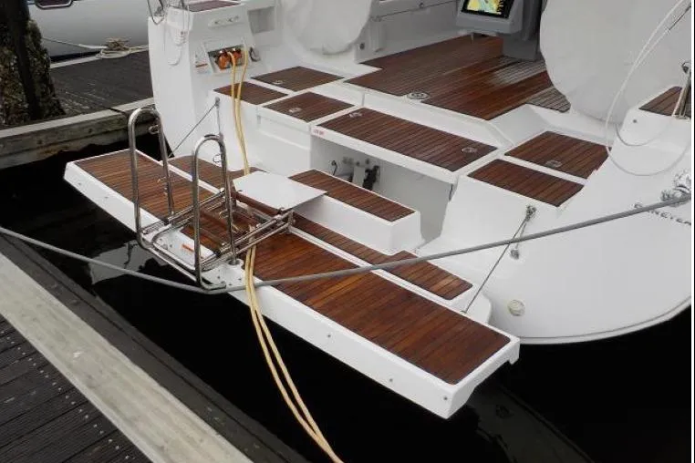  Yacht Photos Pics 2017 Beneteau Oceanis 45 yacht with teak deck and swim platform at marina.