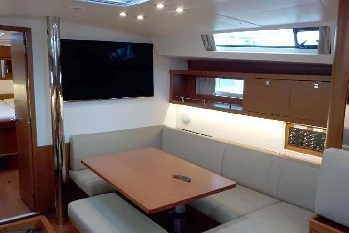  Yacht Photos Pics Interior of 2017 Beneteau Oceanis 45 yacht with modern seating and entertainment area.
