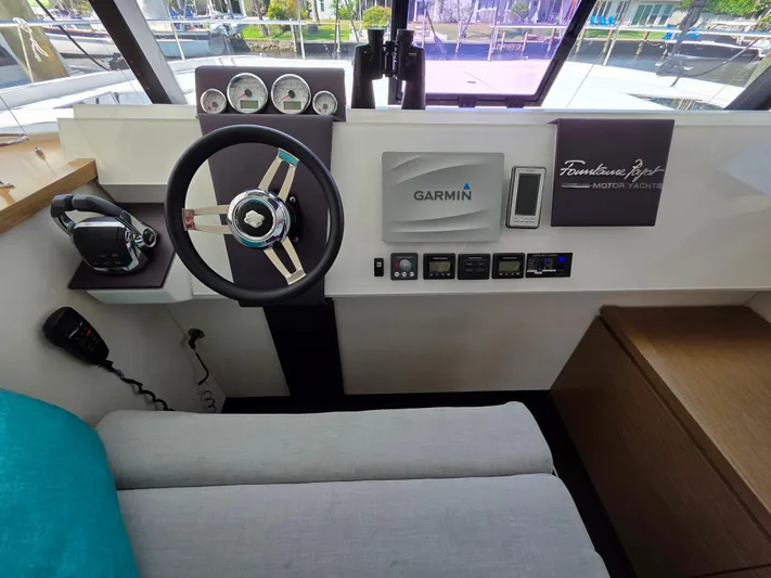 Neptune's Revenge Yacht Photos Pics Helm of 2017 Fountaine Pajot MY37 with Garmin navigation system and modern controls.