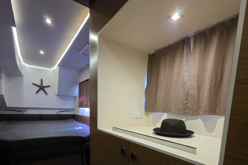 Neptune's Revenge Yacht Photos Pics Luxurious cabin interior of 2017 Fountaine Pajot MY37 yacht with modern decor.