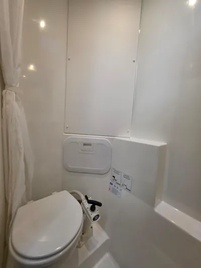 Neptune's Revenge Yacht Photos Pics 2017 Fountaine Pajot MY37 yacht bathroom with white fixtures and compact design.