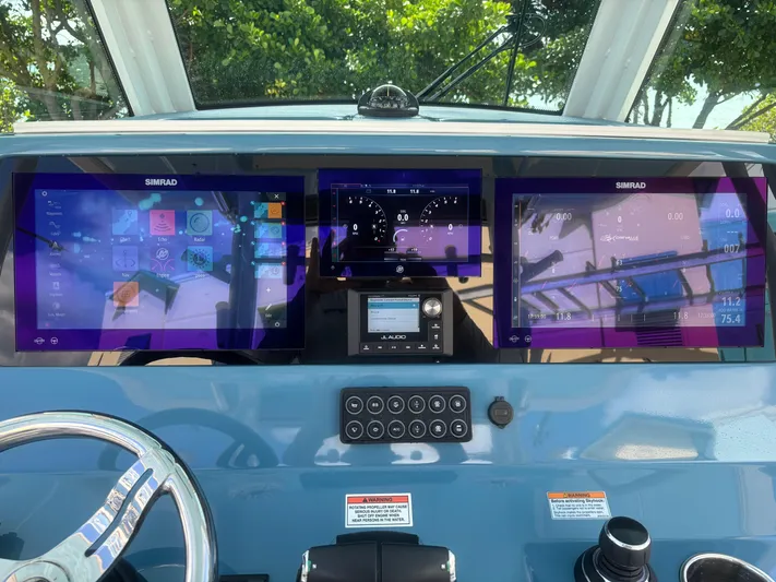  Yacht Photos Pics 2024 Crevalle 33 CSF boat dashboard with advanced Simrad navigation displays.