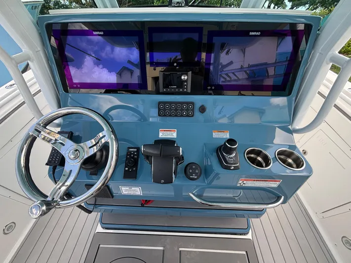  Yacht Photos Pics 2024 Crevalle 33 CSF helm with modern controls and triple screens.