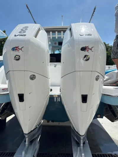  Yacht Photos Pics 2024 Crevalle 33 CSF boat with dual outboard engines, rear view.