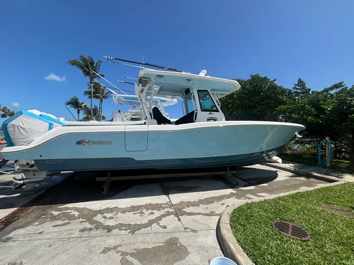  Yacht Photos Pics 2024 Crevalle 33 CSF boat on display, docked outdoors under clear blue sky.