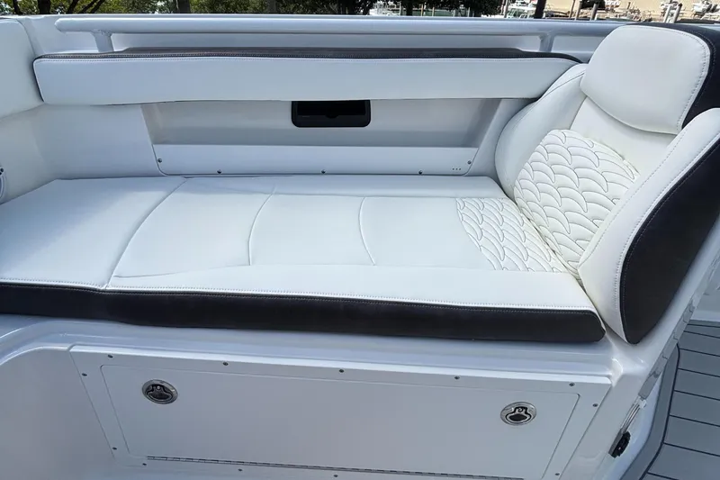  Yacht Photos Pics 2024 Crevalle 33 CSF boat interior with white cushioned seating.