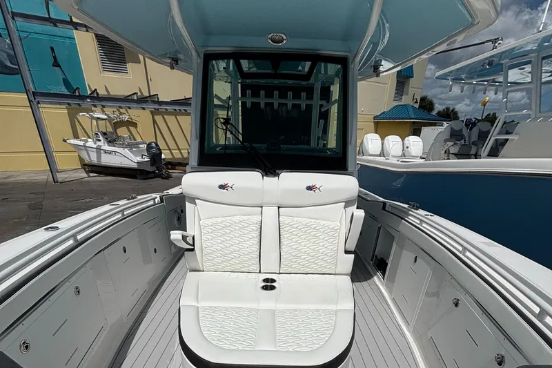  Yacht Photos Pics 2024 Crevalle 33 CSF boat interior with white seating and sleek design.