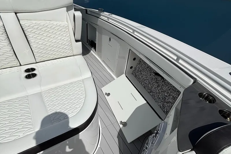  Yacht Photos Pics 2024 Crevalle 33 CSF boat interior with white seating and storage compartment.