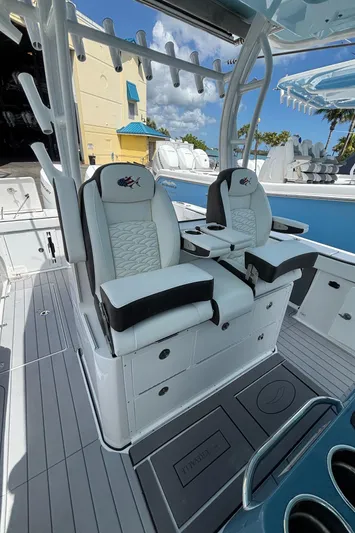  Yacht Photos Pics 2024 Crevalle 33 CSF boat interior with dual cushioned seats and rod holders.