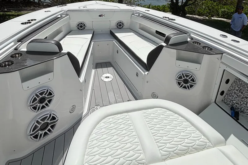  Yacht Photos Pics 2024 Crevalle 33 CSF boat interior with white seating and speakers.