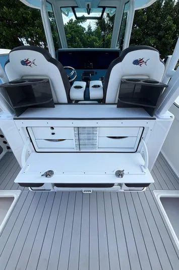  Yacht Photos Pics 2024 Crevalle 33 CSF boat interior with seating and storage compartments.