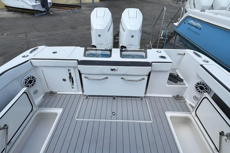  Yacht Photos Pics 2024 Crevalle 33 CSF boat deck with dual engines and storage compartments.