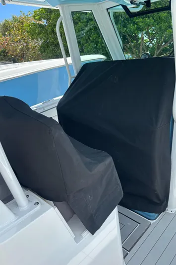  Yacht Photos Pics 2024 Crevalle 33 CSF boat interior with covered seats and console.