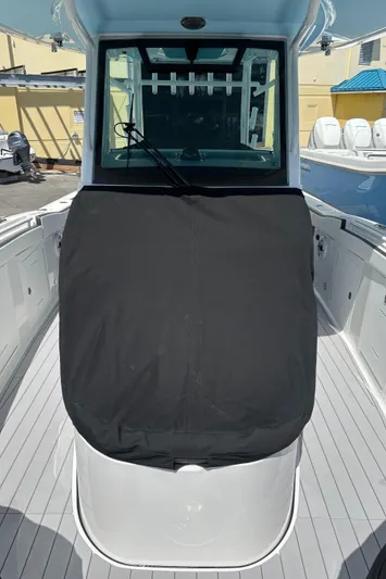  Yacht Photos Pics 2024 Crevalle 33 CSF boat with covered console, docked outdoors.