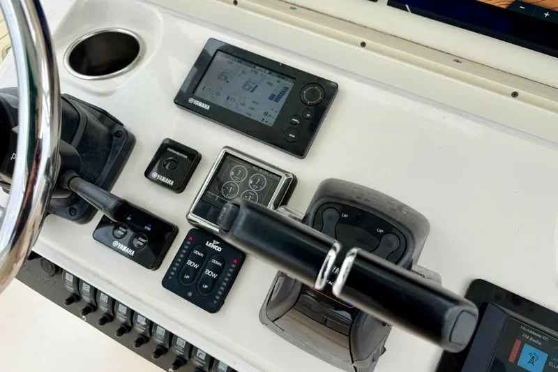  Yacht Photos Pics Control panel of a 2019 Young Boats 27 with Yamaha electronics and steering wheel.